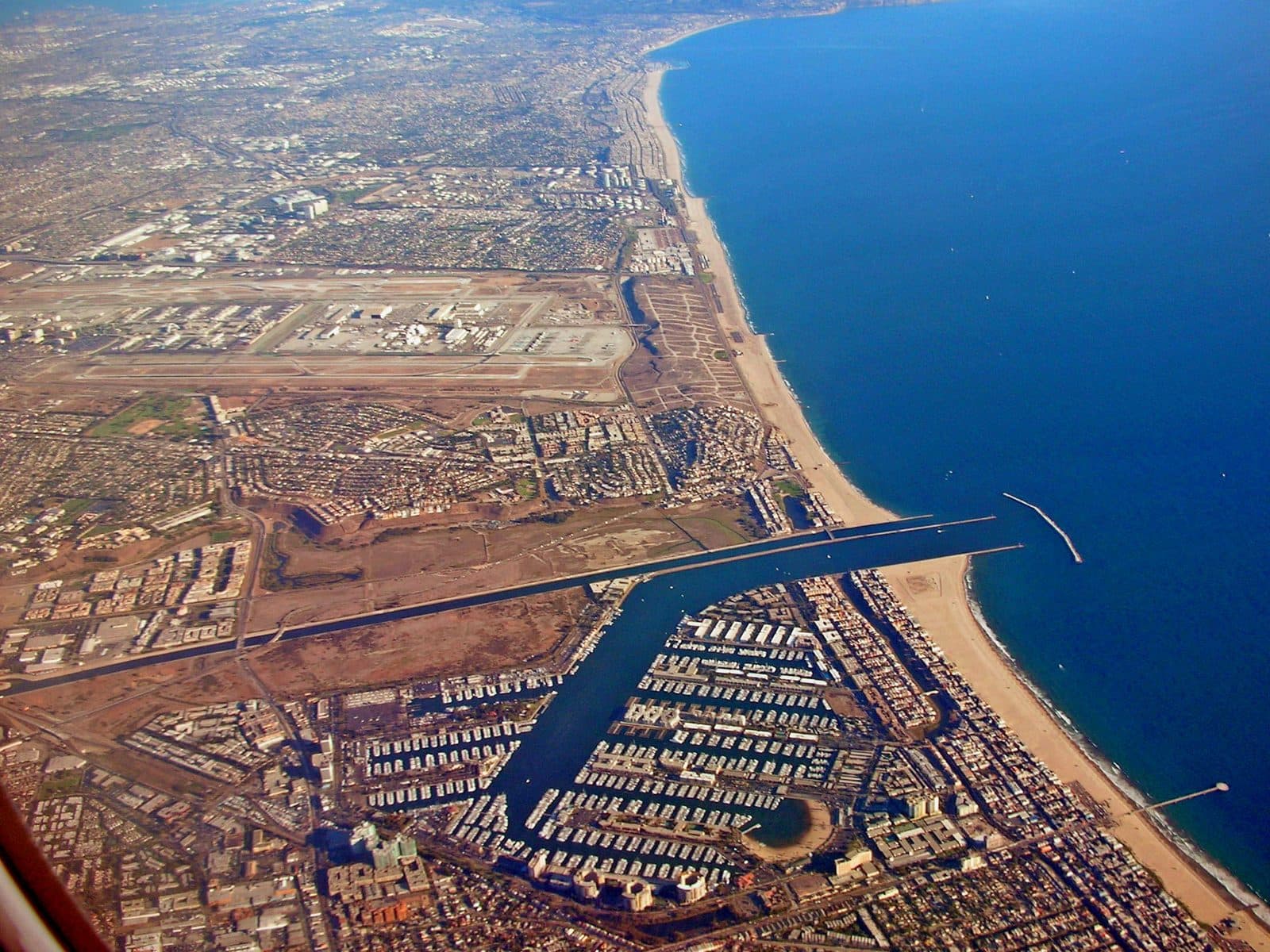 Aerial view of the Marina del Rey harbor, boat slips and coastline along Santa Monica Bay in Los Angeles