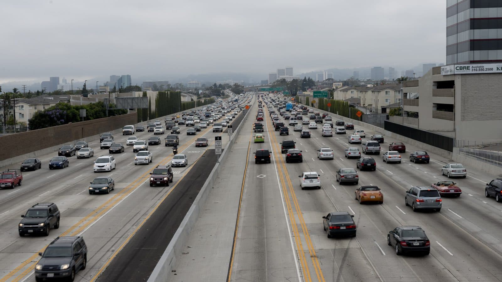Ceramic coating vs. PPF in Los Angeles — 405 freeway traffic Heavy traffic on the 405 freeway in Los Angeles, where road debris and rock chips make paint protection film worth considering