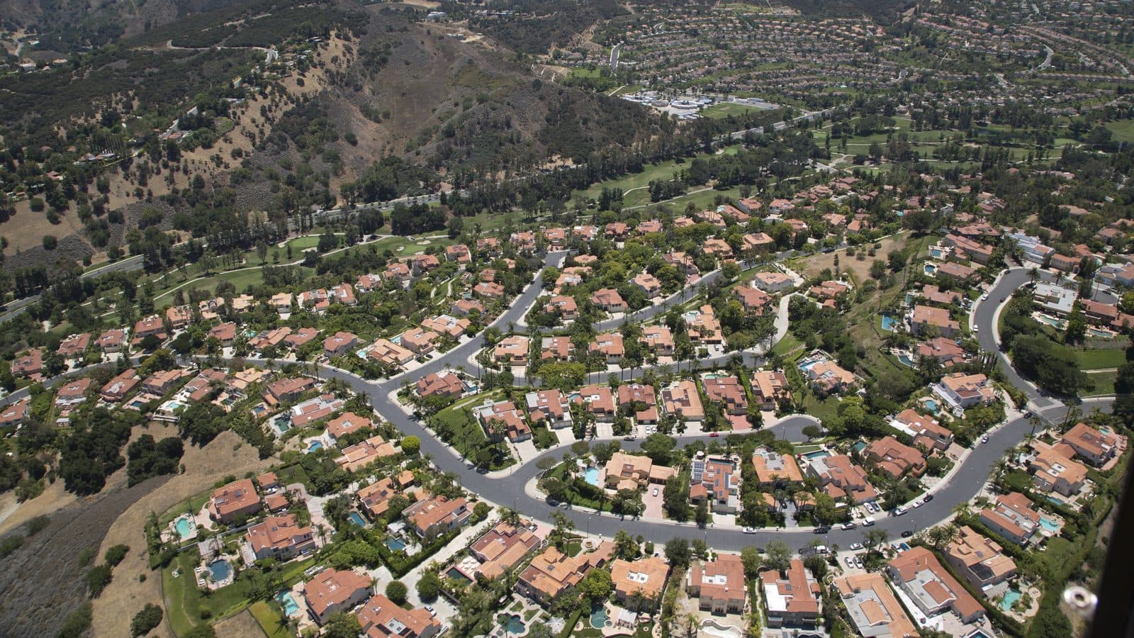 Preparing for a mobile detailing appointment at home in Los Angeles Aerial view of a residential Los Angeles neighborhood of homes and winding streets in the hills
