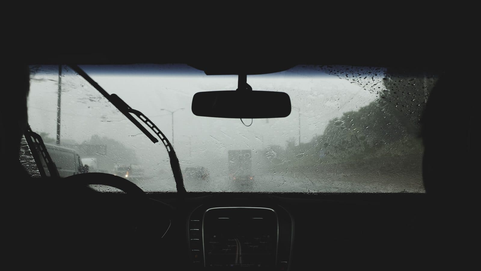 How to get rid of a musty or mildew smell in your car View through a rain-soaked windshield from inside a dark car during a heavy downpour