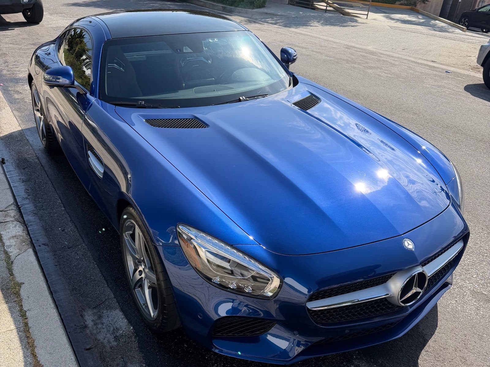 Ceramic Coating — Mercedes-AMG GT high-gloss finish Blue Mercedes-AMG GT coupe with a mirror-like high-gloss paint finish, the result ceramic coating protects in Los Angeles